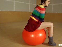 Big ass cardigan babe bouncing on an exercise ball