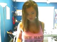 Sexy young amateur coed takes off her tight shirt and bares her beautiful boobs on webcam