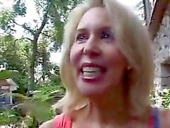 Smiling mature gets big cock in butt