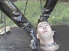 Bizarre outdoor domination with busty femdom