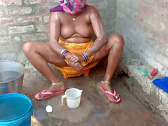 Big boobs Indian Bhabhi taking outdoor bath