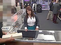 Busty brunette babe sucks cock at the pawn shop