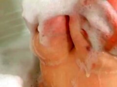 BBW Alice washing her wet soapy monster boob in hot bathtub