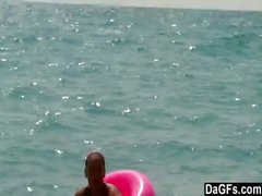 Topless beach bunny swallows a load
